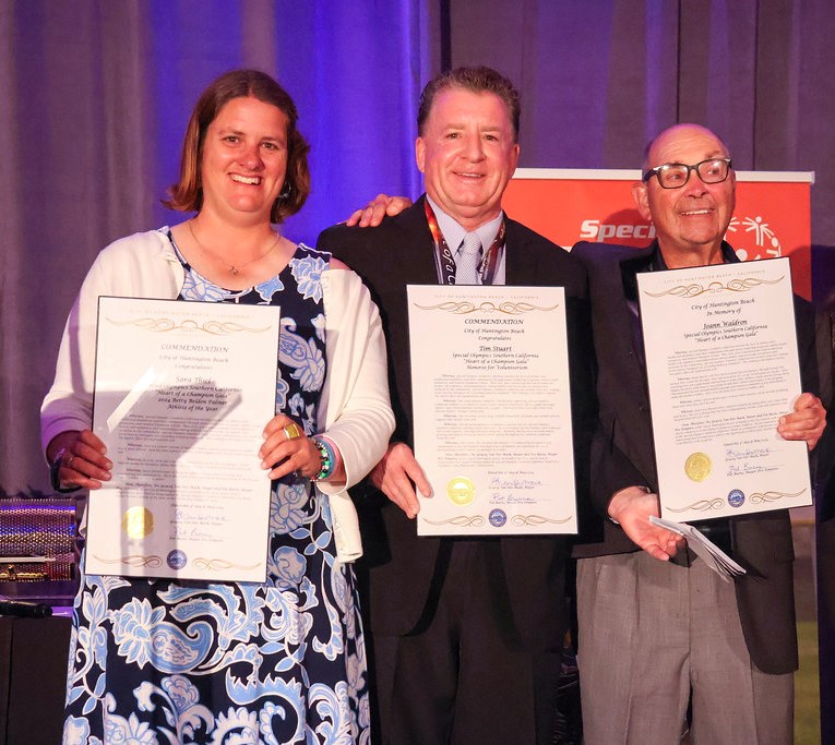 Tim receiving Special Olympics Orange County Volunteer of the Year commendation at the 2023 Heart of a Champion gala, with Sara Thiel and Pete Waldron